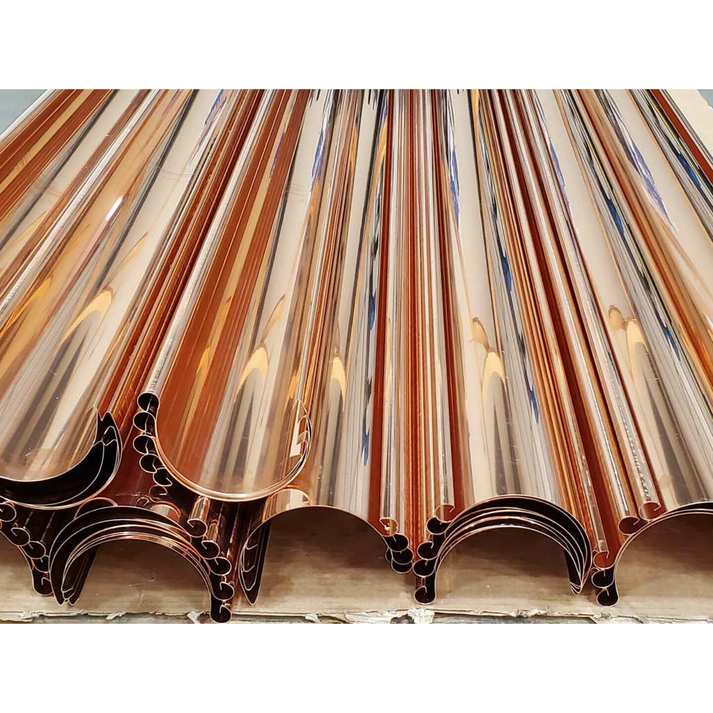 Copper half-round gutter pipe with a white background